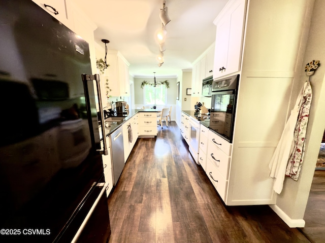 101 Twig Ln, Sunbury, PA 17801 - kitchen featuring black appliances, a peninsula, dark wood-type flooring, white cabinetry, and track lighting