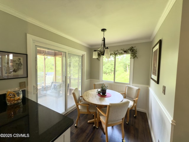 101 Twig Ln, Sunbury, PA 17801 - dining space with wainscoting, ornamental molding, dark wood-style flooring, and a chandelier