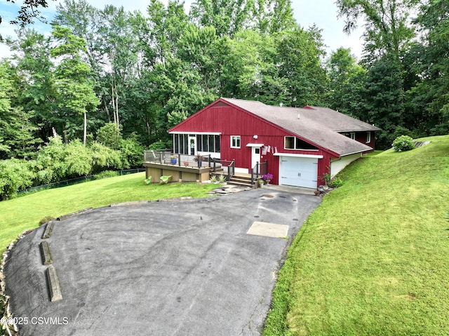 101 Twig Ln, Sunbury, PA 17801 - view of front facade featuring asphalt driveway, a wooden deck, an attached garage, a front yard, and a shingled roof