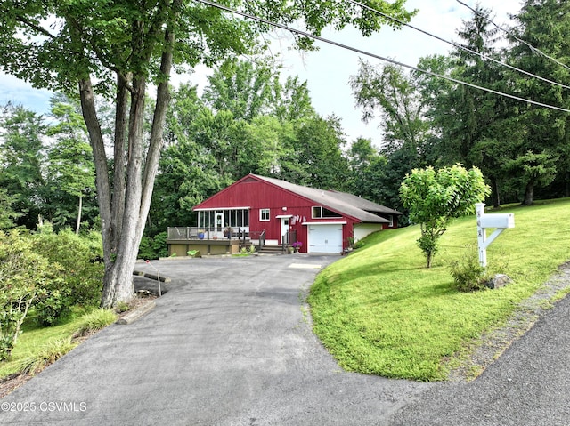 101 Twig Ln, Sunbury, PA 17801 - view of front of home featuring a front lawn, driveway, a deck, and view of wooded area