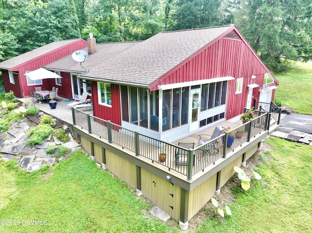 101 Twig Ln, Sunbury, PA 17801 - rear view of property with a shingled roof, a wooden deck, a yard, and a sunroom
