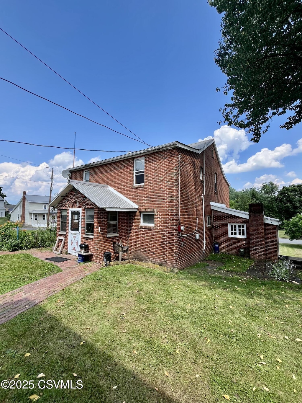 208 S Water St, Selinsgrove, PA 17870 - back of house with brick siding and a lawn