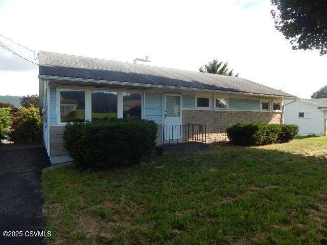 404 W Center St, Elysburg, PA 17824 - view of front of property featuring stone siding and a front lawn