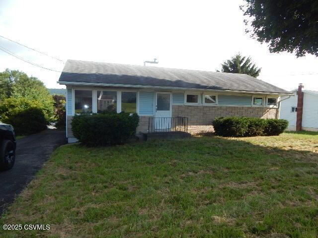 404 W Center St, Elysburg, PA 17824 - view of front of home featuring a front yard and stone siding