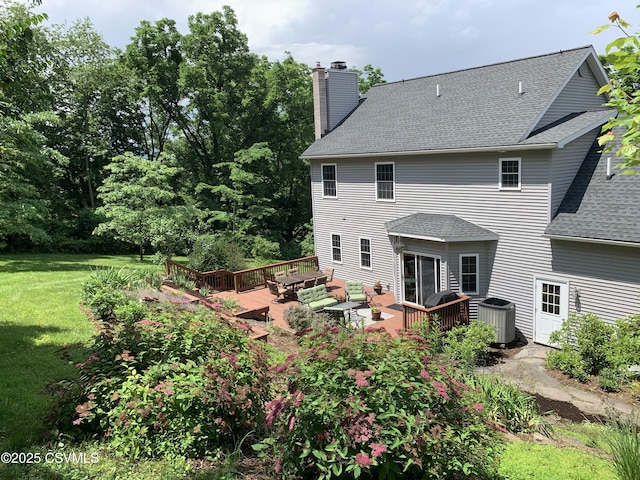 3 Walnut Rd, Lewisburg, PA 17837 - rear view of property with roof with shingles, a chimney, a wooden deck, a lawn, and an outdoor hangout area