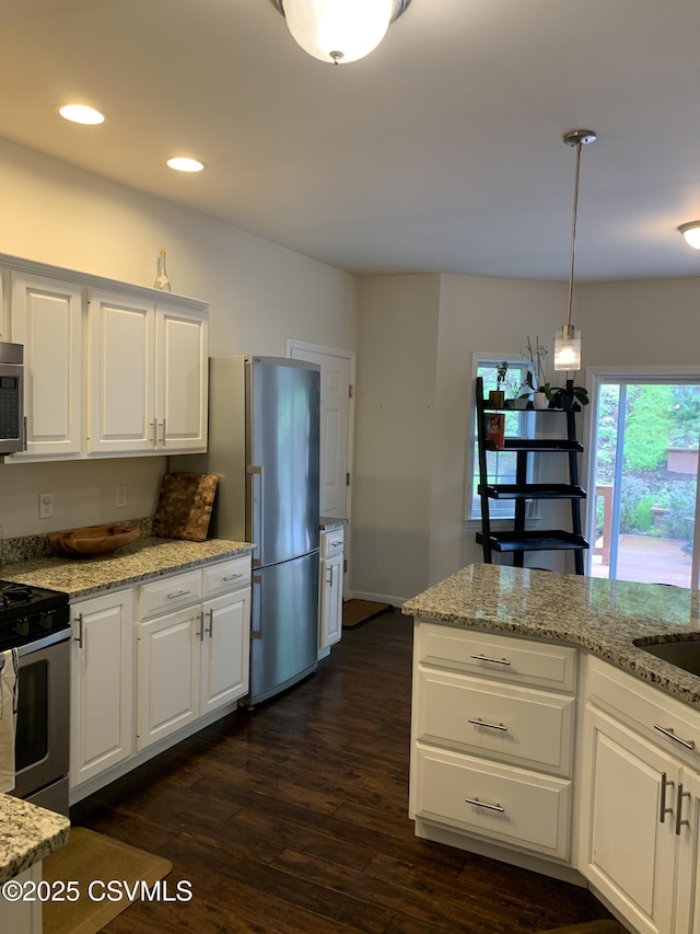 3 Walnut Rd, Lewisburg, PA 17837 - kitchen featuring stainless steel appliances, dark wood-style flooring, white cabinetry, light stone counters, and pendant lighting