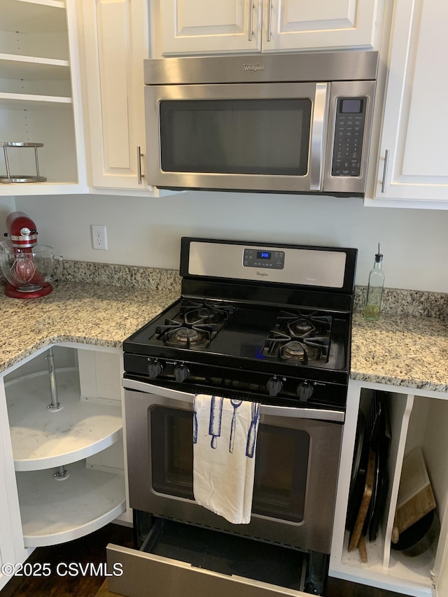 3 Walnut Rd, Lewisburg, PA 17837 - kitchen with appliances with stainless steel finishes, white cabinets, and light stone counters