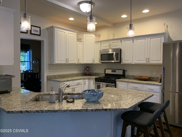 3 Walnut Rd, Lewisburg, PA 17837 - kitchen with appliances with stainless steel finishes, white cabinetry, light stone counters, decorative light fixtures, and recessed lighting