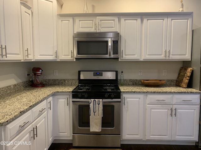 3 Walnut Rd, Lewisburg, PA 17837 - kitchen with stainless steel appliances, white cabinets, and light stone countertops