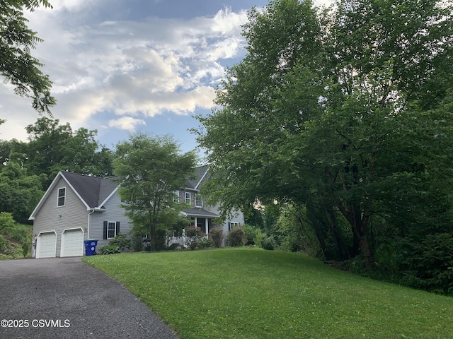 3 Walnut Rd, Lewisburg, PA 17837 - obstructed view of property featuring driveway, an attached garage, and a front yard