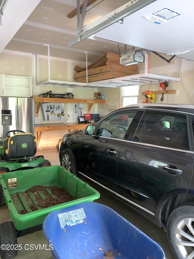 3 Walnut Rd, Lewisburg, PA 17837 - garage with stainless steel refrigerator with ice dispenser and a garage door opener