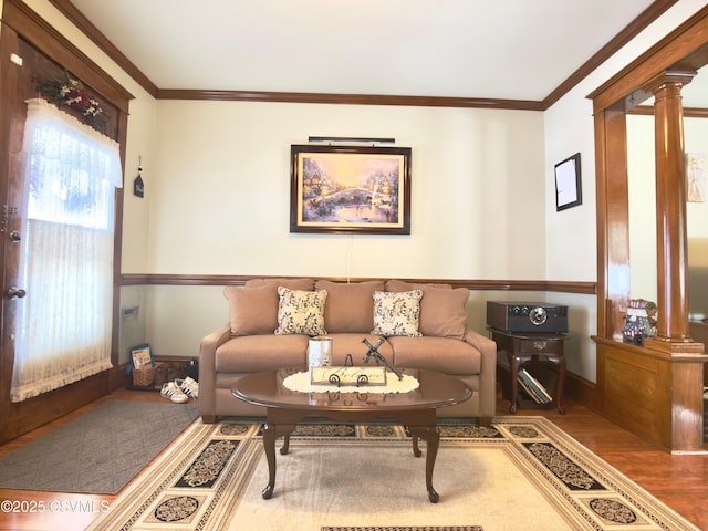 230 S 6th St, Shamokin, PA 17872 - living area with wood finished floors, decorative columns, and ornamental molding