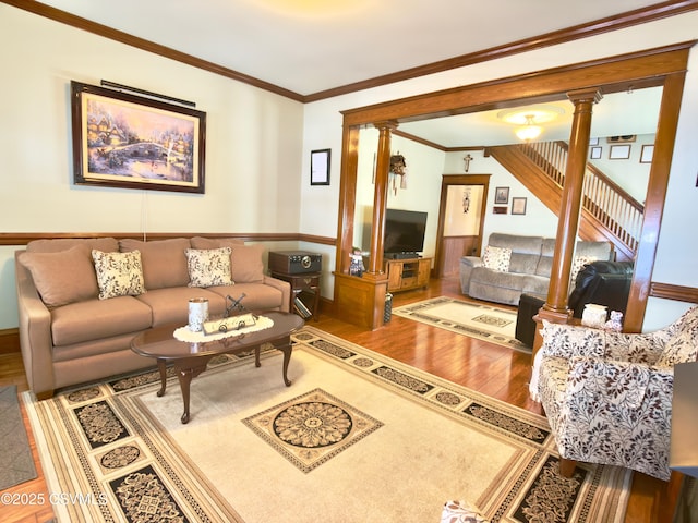 230 S 6th St, Shamokin, PA 17872 - living area featuring wood finished floors, decorative columns, and crown molding