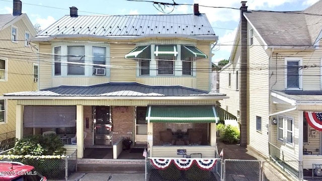 230 S 6th St, Shamokin, PA 17872 - view of front of property featuring a metal roof, a chimney, and brick siding