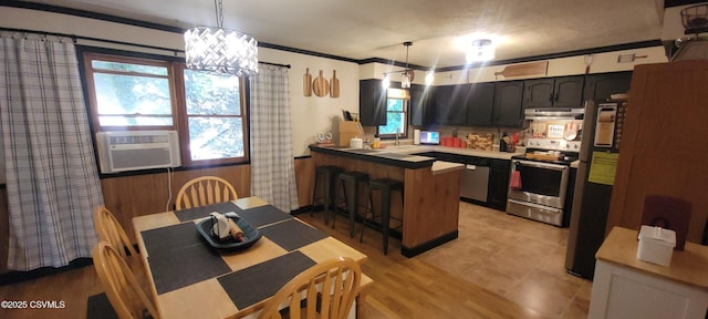 97 Maplewood Rd, Berwick, PA 18603 - kitchen with stainless steel appliances, under cabinet range hood, a peninsula, cooling unit, and plenty of natural light