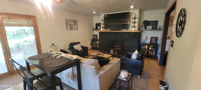 97 Maplewood Rd, Berwick, PA 18603 - living room featuring a warm lit fireplace, recessed lighting, and ceiling fan