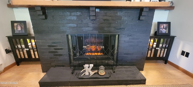 97 Maplewood Rd, Berwick, PA 18603 - detailed view of wood finished floors and a brick fireplace