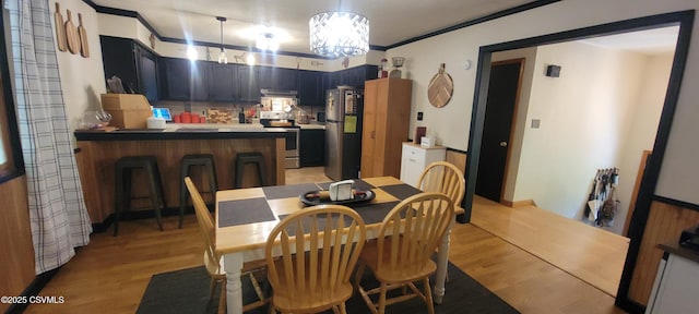 97 Maplewood Rd, Berwick, PA 18603 - dining room with light wood-style flooring, ornamental molding, and a chandelier
