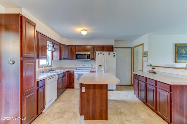 95 Five Points Rd, Muncy, PA 17756 - kitchen with white appliances, dark brown cabinets, light countertops, and a kitchen island