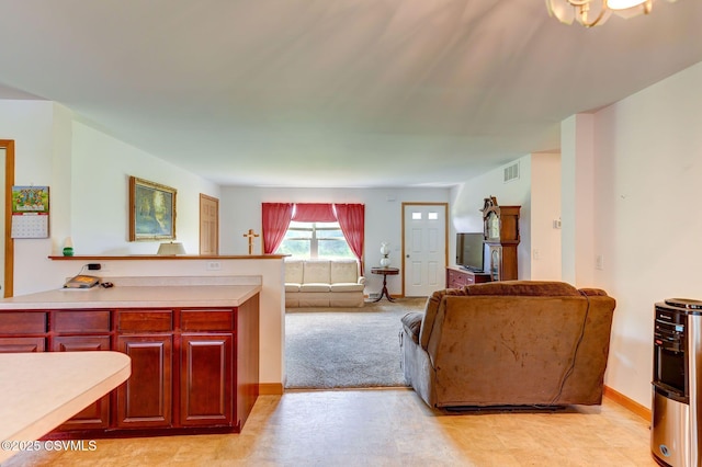 95 Five Points Rd, Muncy, PA 17756 - kitchen featuring light countertops, open floor plan, and reddish brown cabinets