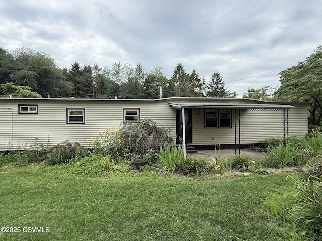 25 Wolfe Rd, Nescopeck, PA 18635 - back of house with a yard and a patio area