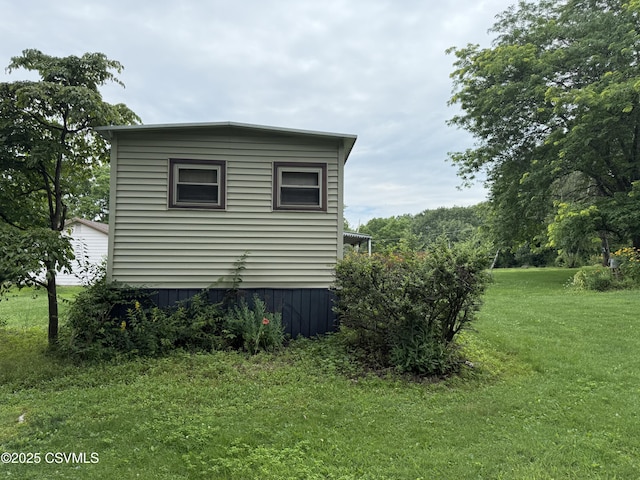 25 Wolfe Rd, Nescopeck, PA 18635 - view of side of home featuring a yard