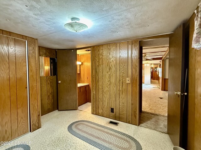 25 Wolfe Rd, Nescopeck, PA 18635 - unfurnished bedroom with wooden walls and a textured ceiling