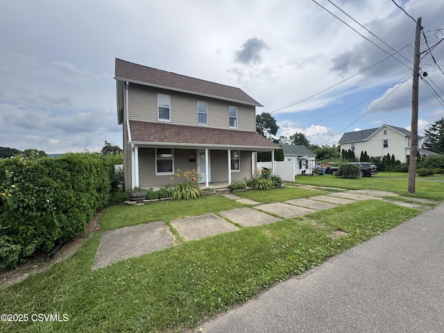 1715 Spring Garden Ave, Berwick, PA 18603 - view of front of house featuring a porch, a front lawn, and roof with shingles