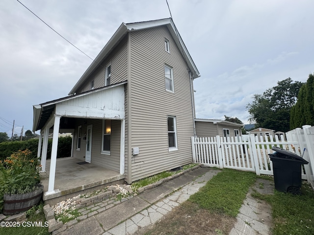 1715 Spring Garden Ave, Berwick, PA 18603 - view of side of property featuring a patio area and a gate