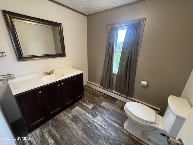1715 Spring Garden Ave, Berwick, PA 18603 - bathroom featuring wood finished floors, vanity, and baseboard heating