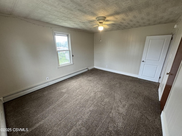 1715 Spring Garden Ave, Berwick, PA 18603 - unfurnished room with a baseboard heating unit, a ceiling fan, dark colored carpet, and an ornate ceiling