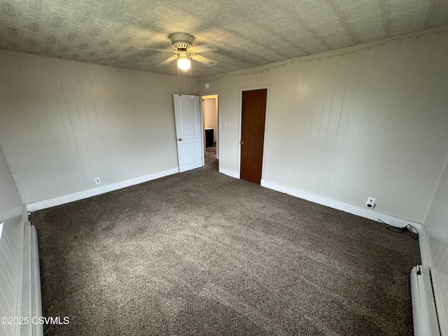 1715 Spring Garden Ave, Berwick, PA 18603 - unfurnished room with a baseboard heating unit, a ceiling fan, and dark carpet