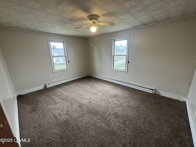 1715 Spring Garden Ave, Berwick, PA 18603 - carpeted spare room featuring a ceiling fan, an ornate ceiling, and a baseboard radiator