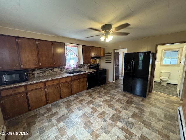 1715 Spring Garden Ave, Berwick, PA 18603 - kitchen featuring black appliances, a ceiling fan, tasteful backsplash, under cabinet range hood, and light stone finish floors