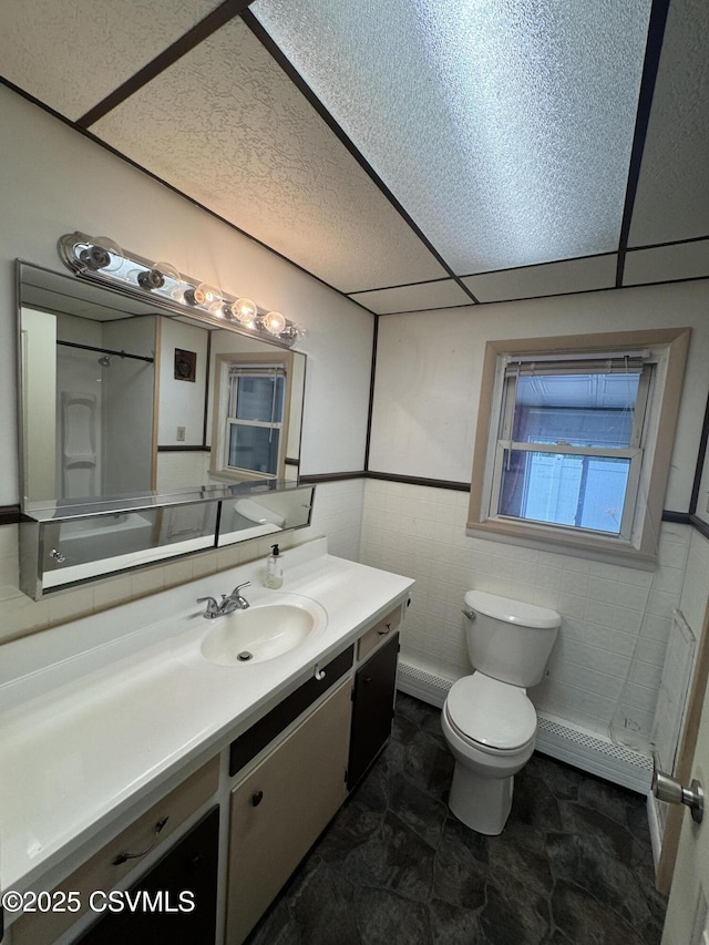 1715 Spring Garden Ave, Berwick, PA 18603 - bathroom with tile walls, vanity, and a wainscoted wall