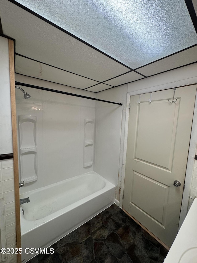 1715 Spring Garden Ave, Berwick, PA 18603 - bathroom with  shower combination, stone finish floors, and a textured ceiling
