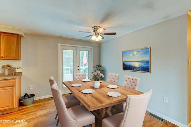 745 Liberty St, Danville, PA 17821 - dining area featuring light wood-type flooring, french doors, ceiling fan, and ornamental molding