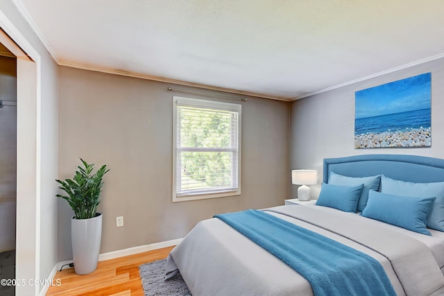 745 Liberty St, Danville, PA 17821 - bedroom with light wood-type flooring and ornamental molding