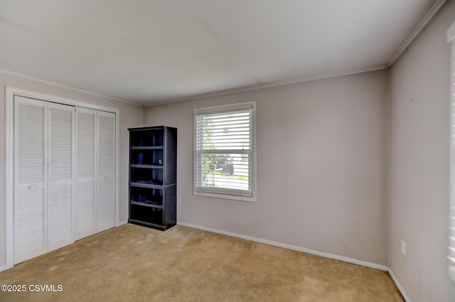 745 Liberty St, Danville, PA 17821 - unfurnished bedroom featuring light colored carpet, ornamental molding, and a closet