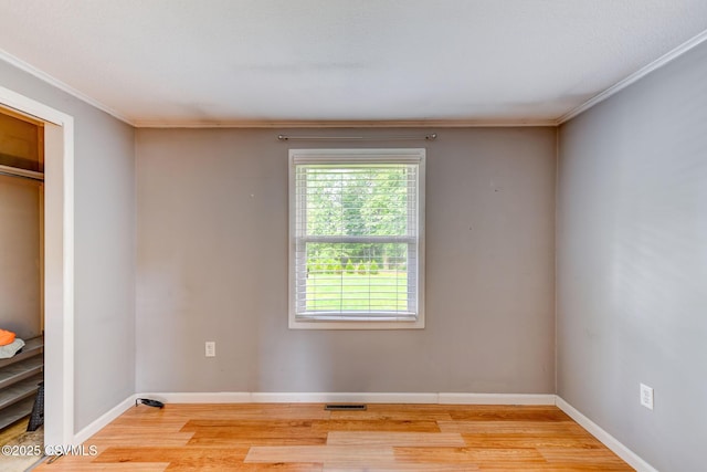 745 Liberty St, Danville, PA 17821 - unfurnished bedroom featuring ornamental molding, light wood finished floors, and multiple windows