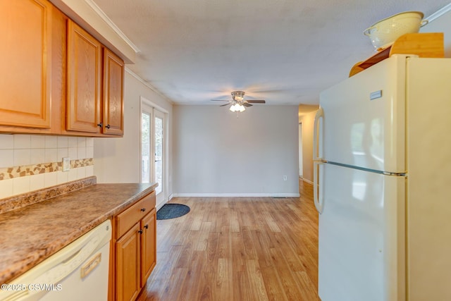 745 Liberty St, Danville, PA 17821 - kitchen featuring white appliances, a ceiling fan, light wood-style flooring, backsplash, and brown cabinets