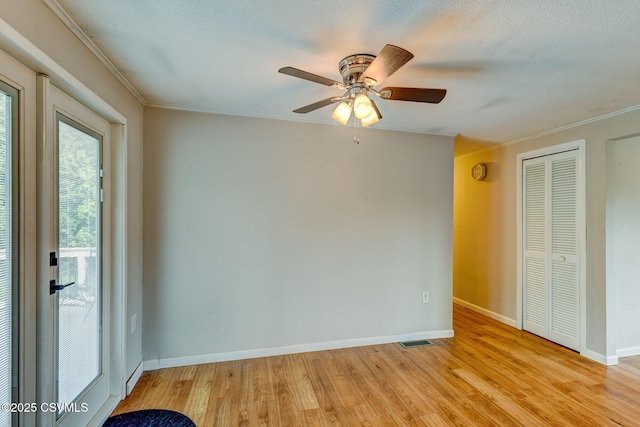 745 Liberty St, Danville, PA 17821 - empty room with light wood-style floors, crown molding, and a ceiling fan