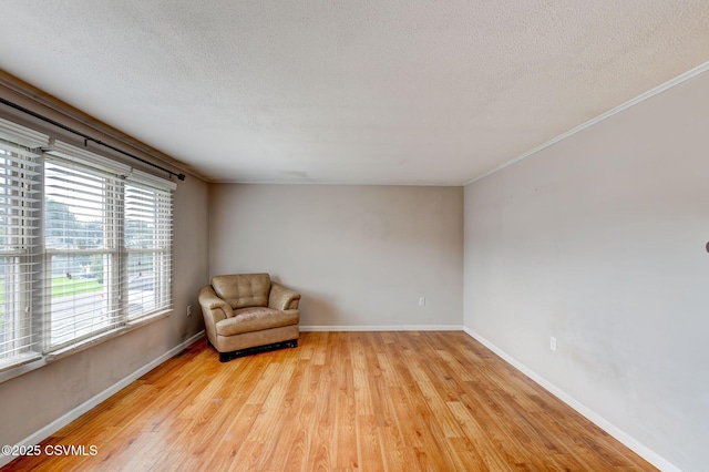 745 Liberty St, Danville, PA 17821 - unfurnished room featuring a textured ceiling, light wood-type flooring, and crown molding