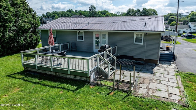745 Liberty St, Danville, PA 17821 - back of property featuring a yard, a metal roof, and a deck