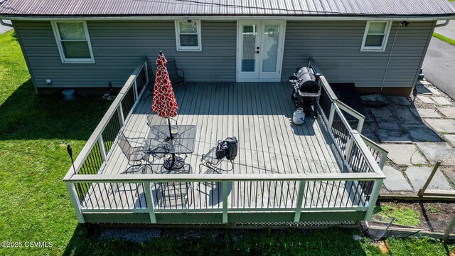 745 Liberty St, Danville, PA 17821 - rear view of property with a metal roof, a deck, french doors, and a yard