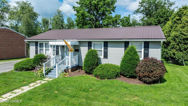 745 Liberty St, Danville, PA 17821 - view of front of property featuring a metal roof and a front yard