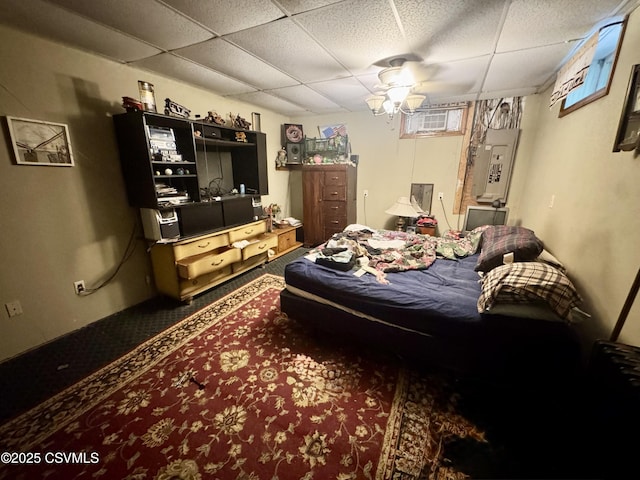 249 E Haas Manor Rd, Sunbury, PA 17801 - bedroom featuring a paneled ceiling, a wall unit AC, and electric panel