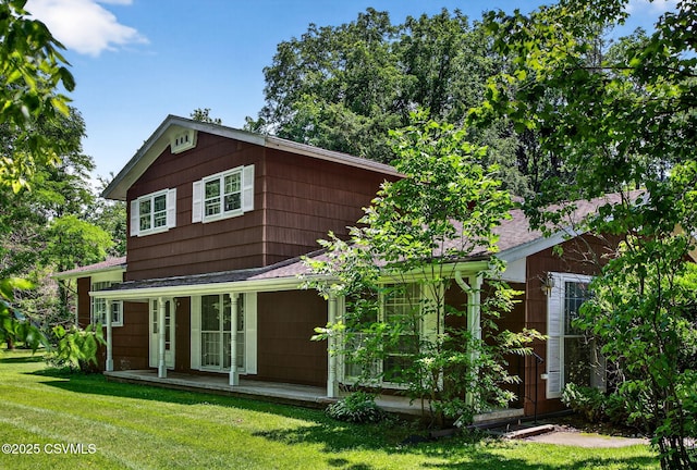 725 Avenue Ave E, Danville, PA 17821 - rear view of house with a yard, covered porch, and a shingled roof