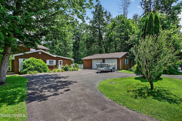 725 Avenue Ave E, Danville, PA 17821 - view of front of home with an outdoor structure, a detached garage, and a front yard