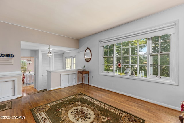 725 Avenue Ave E, Danville, PA 17821 - living area with wood-type flooring, healthy amount of natural light, and a chandelier